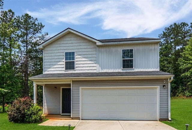 20 Sloane Ct, Covington, GA 30016 - view of front facade with a front lawn, driveway, an attached garage, and a porch