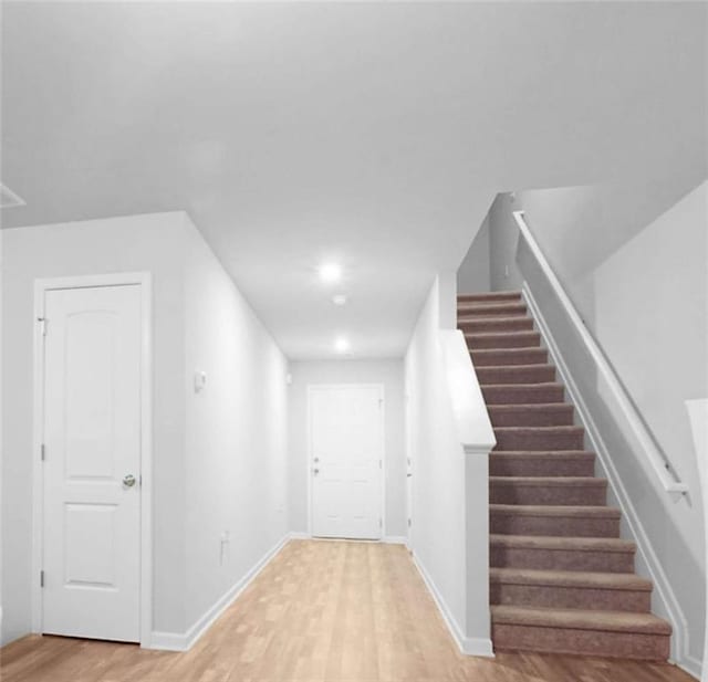 20 Sloane Ct, Covington, GA 30016 - stairway featuring wood finished floors and baseboards