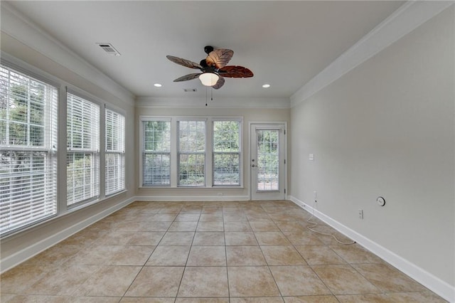 unfurnished sunroom with baseboards, visible vents, crown molding, and tile patterned flooring