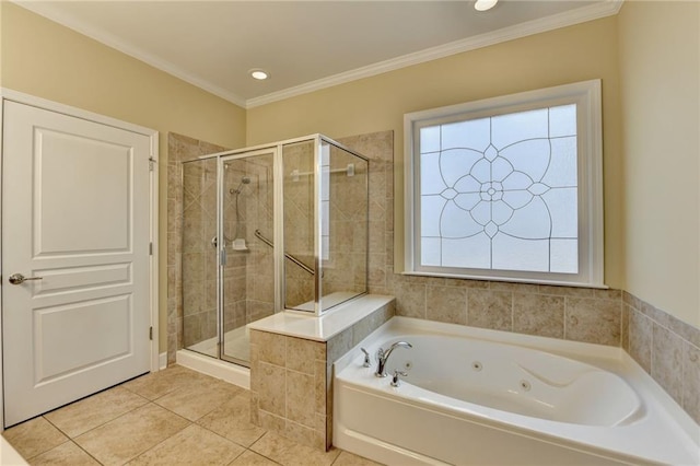 bathroom featuring crown molding, a jetted tub, tile patterned flooring, and a shower stall