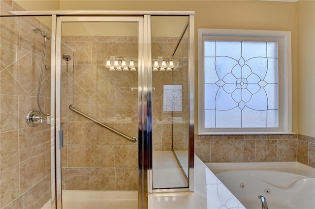 bathroom with a shower stall and a jetted tub