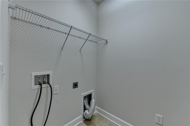 clothes washing area featuring tile patterned flooring, baseboards, electric dryer hookup, laundry area, and washer hookup