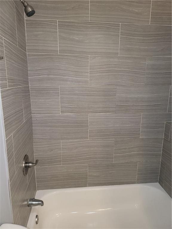 4664 Ryan Rd, Conley, GA 30288 - bathroom featuring shower / washtub combination and toilet