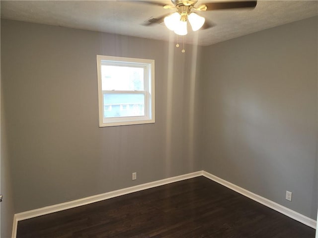 4664 Ryan Rd, Conley, GA 30288 - spare room featuring dark wood-type flooring, ceiling fan, baseboards, and a textured ceiling