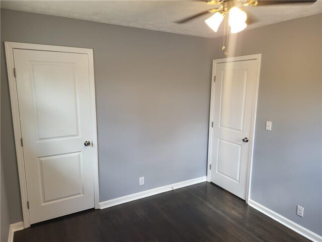 4664 Ryan Rd, Conley, GA 30288 - empty room with ceiling fan, dark wood finished floors, and baseboards