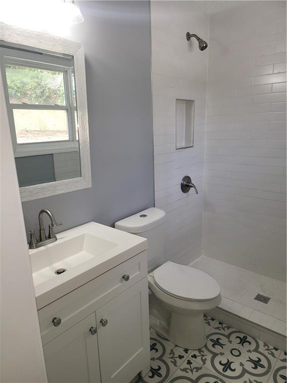 4664 Ryan Rd, Conley, GA 30288 - bathroom with a tile shower, vanity, toilet, and tile patterned flooring