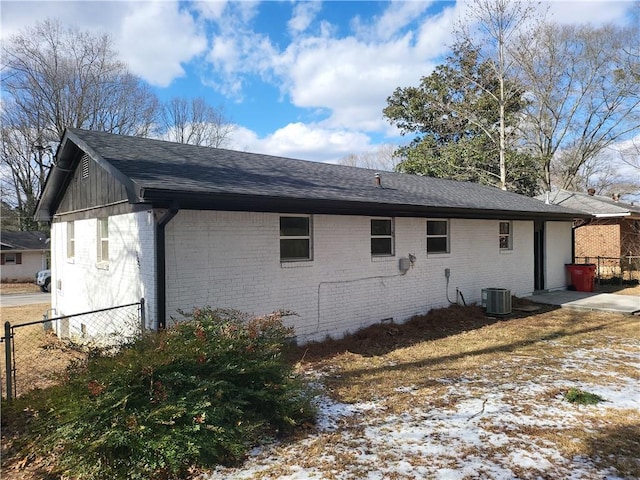 4664 Ryan Rd, Conley, GA 30288 - view of side of property with brick siding, central air condition unit, and a shingled roof