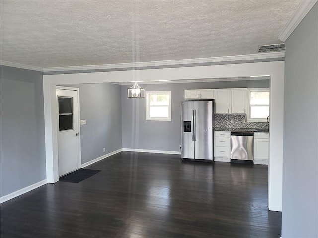 4664 Ryan Rd, Conley, GA 30288 - kitchen with stainless steel appliances, crown molding, a textured ceiling, dark wood-style floors, and white cabinets