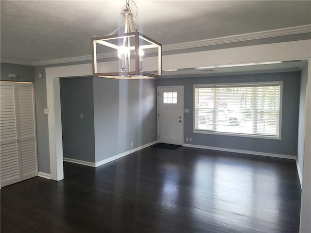 4664 Ryan Rd, Conley, GA 30288 - unfurnished dining area featuring a chandelier, baseboards, dark wood-style flooring, and crown molding