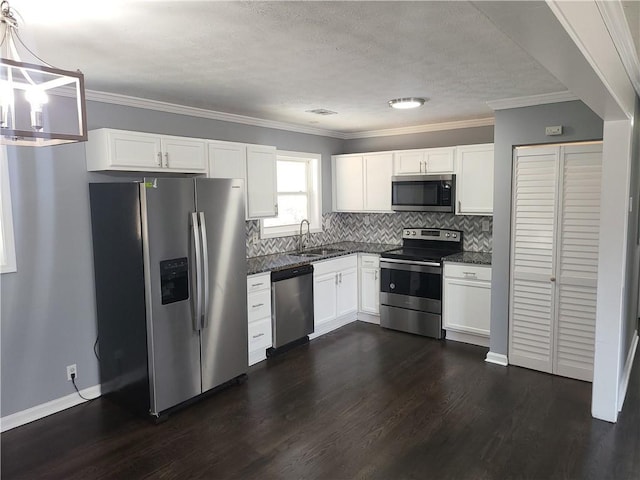 4664 Ryan Rd, Conley, GA 30288 - kitchen featuring stainless steel appliances, a sink, dark wood-type flooring, white cabinets, and tasteful backsplash
