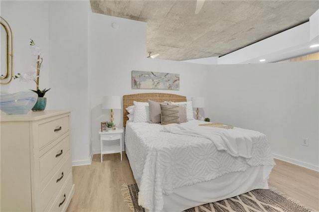 bedroom with baseboards and light wood-style floors