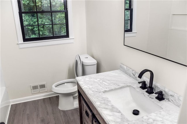 3530 Turner Heights Dr, Decatur, GA 30032 - bathroom featuring healthy amount of natural light, vanity, and wood finished floors