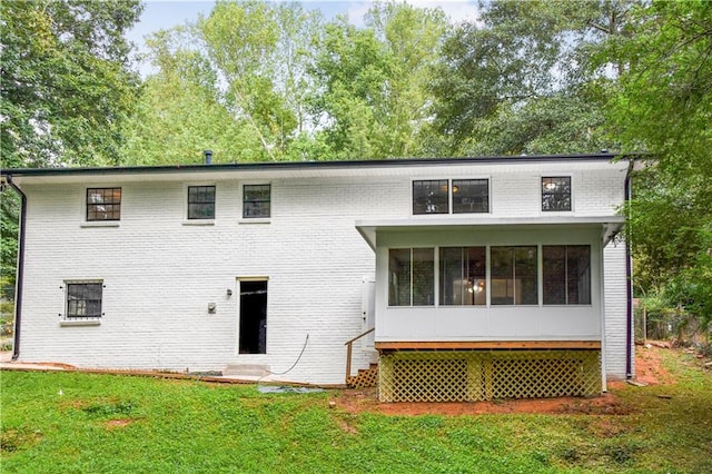 3530 Turner Heights Dr, Decatur, GA 30032 - rear view of property with a yard, a sunroom, and brick siding