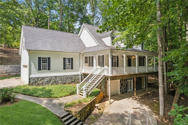 view of front of house with a porch and a garage