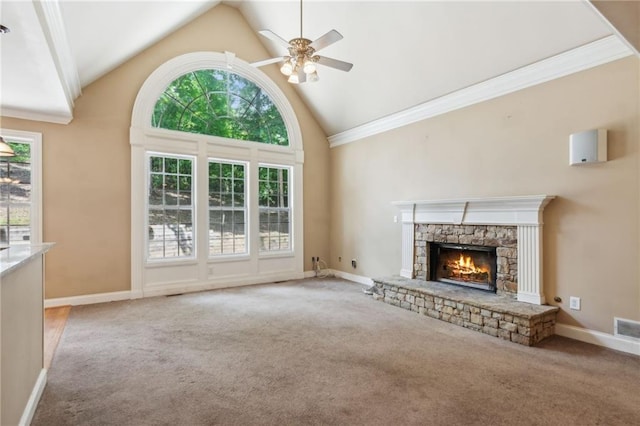 unfurnished living room with a stone fireplace, high vaulted ceiling, ceiling fan, and carpet flooring