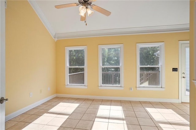 spare room with ceiling fan, light tile patterned floors, and ornamental molding