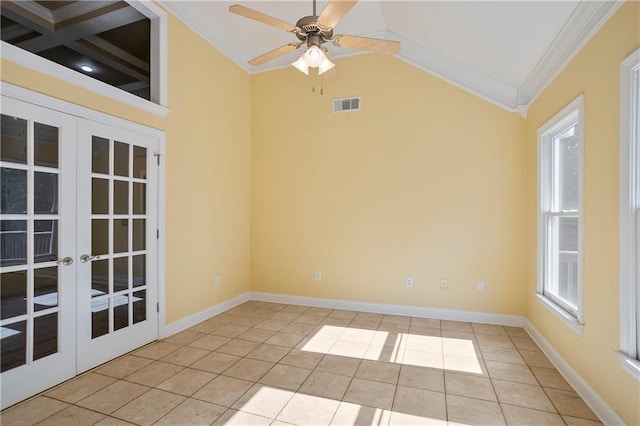 tiled spare room featuring french doors, coffered ceiling, ornamental molding, and ceiling fan