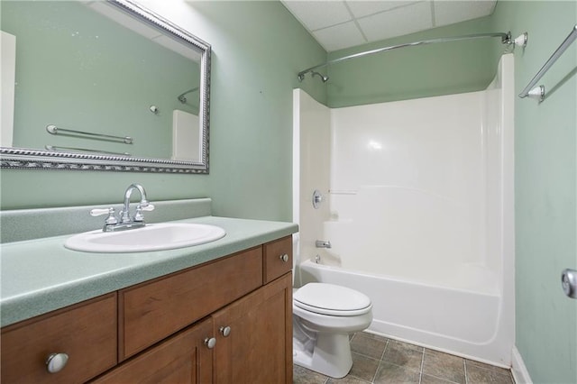 full bathroom featuring shower / bathing tub combination, tile patterned floors, vanity, and toilet