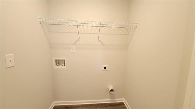 clothes washing area with laundry area, hookup for a washing machine, baseboards, and electric dryer hookup