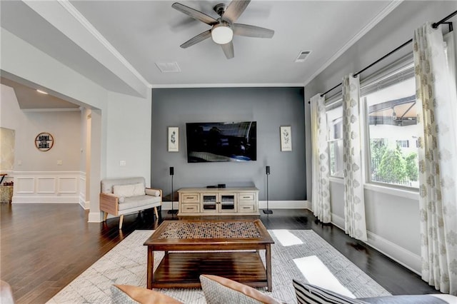7470 Oldbury Pl, Cumming, GA 30040 - living area featuring ceiling fan, dark wood finished floors, ornamental molding, and a wainscoted wall