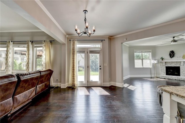 7470 Oldbury Pl, Cumming, GA 30040 - foyer entrance featuring a chandelier, baseboards, a ceiling fan, crown molding, and dark wood-style floors