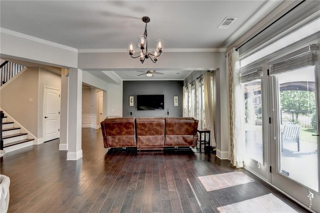 7470 Oldbury Pl, Cumming, GA 30040 - living area featuring stairway, ceiling fan, a chandelier, hardwood / wood-style floors, and ornamental molding
