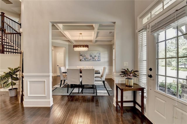 7470 Oldbury Pl, Cumming, GA 30040 - foyer entrance with coffered ceiling, a chandelier, beam ceiling, dark wood-style flooring, and a wainscoted wall