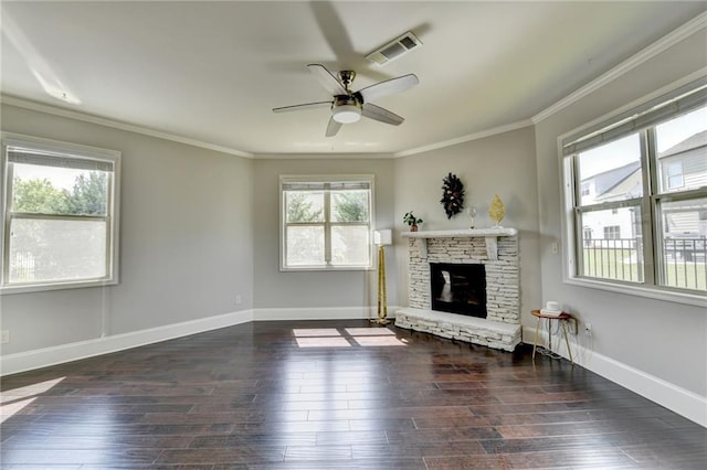 7470 Oldbury Pl, Cumming, GA 30040 - unfurnished living room featuring a ceiling fan, a stone fireplace, dark wood-style floors, crown molding, and baseboards