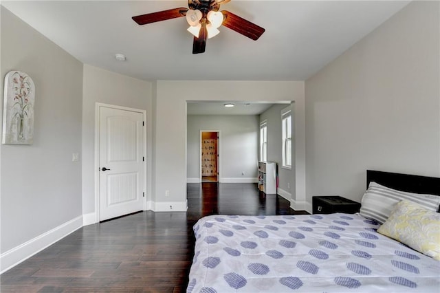 7470 Oldbury Pl, Cumming, GA 30040 - bedroom featuring wood finished floors, baseboards, and a ceiling fan