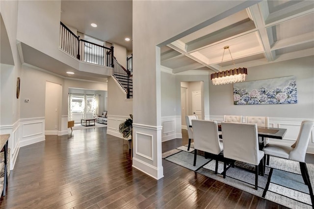 7470 Oldbury Pl, Cumming, GA 30040 - dining room with a chandelier, dark wood-style floors, beamed ceiling, a decorative wall, and coffered ceiling