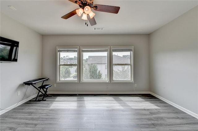 7470 Oldbury Pl, Cumming, GA 30040 - unfurnished room featuring ceiling fan, wood finished floors, and baseboards