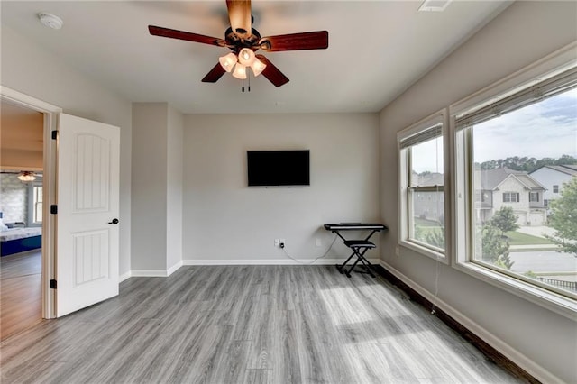 7470 Oldbury Pl, Cumming, GA 30040 - empty room featuring ceiling fan, wood finished floors, baseboards, and a smoke detector