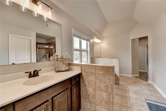 7470 Oldbury Pl, Cumming, GA 30040 - full bath with vaulted ceiling, vanity, tiled shower, baseboards, and tile patterned floors