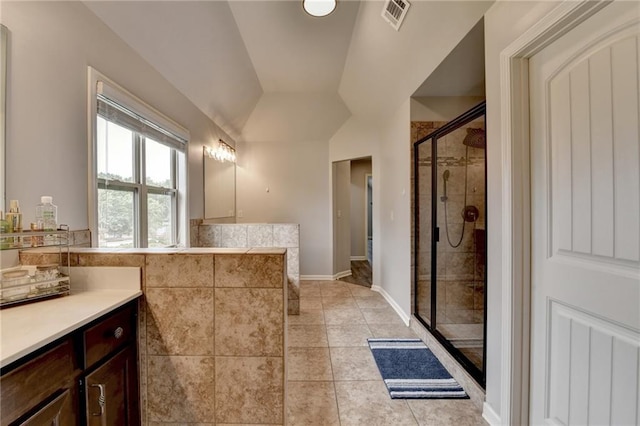 7470 Oldbury Pl, Cumming, GA 30040 - full bath featuring a stall shower, vanity, vaulted ceiling, tile patterned floors, and baseboards