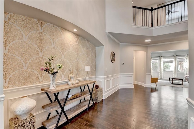 7470 Oldbury Pl, Cumming, GA 30040 - entrance foyer featuring a high ceiling, wood finished floors, wainscoting, and a decorative wall
