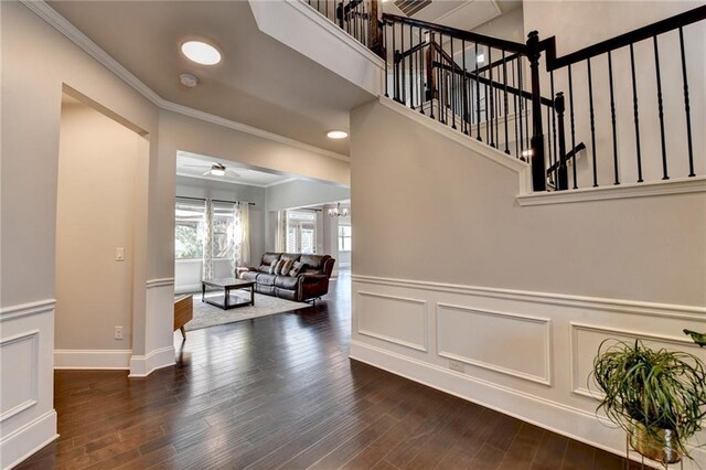 7470 Oldbury Pl, Cumming, GA 30040 - stairs with a ceiling fan, crown molding, wood finished floors, a wainscoted wall, and baseboards