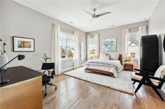 bedroom featuring ceiling fan and light hardwood / wood-style floors