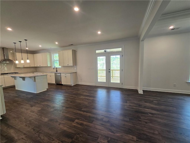 3677 Thornhill Ct, Douglasville, GA 30135 - kitchen with wall chimney exhaust hood, ornamental molding, dishwasher, french doors, and backsplash