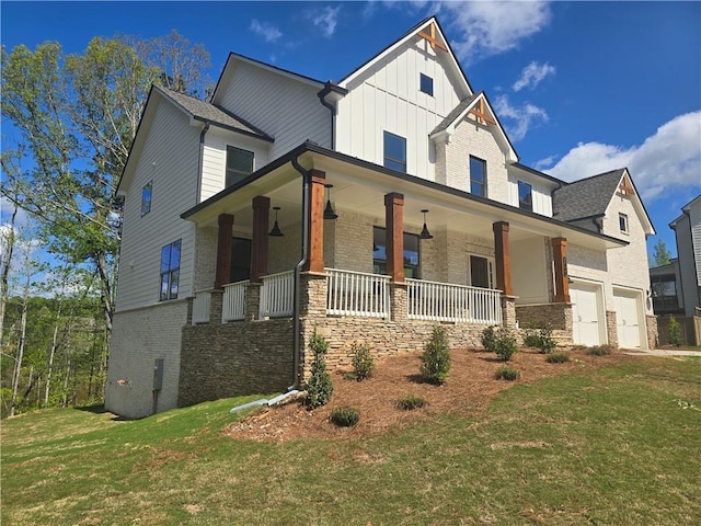 3677 Thornhill Ct, Douglasville, GA 30135 - view of front of house featuring board and batten siding, a porch, a front lawn, and a garage