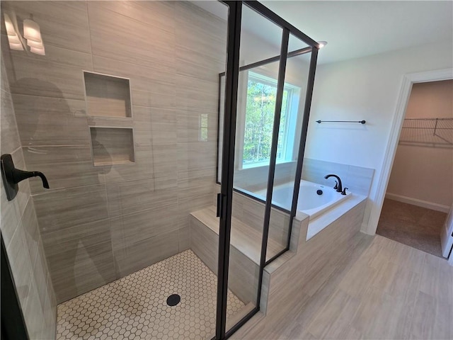 3677 Thornhill Ct, Douglasville, GA 30135 - full bath with a stall shower, a bath, and a walk in closet