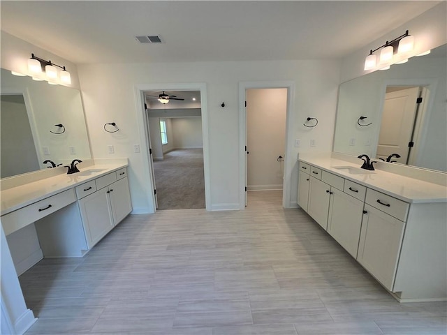 3677 Thornhill Ct, Douglasville, GA 30135 - bathroom featuring ceiling fan, two vanities, and baseboards
