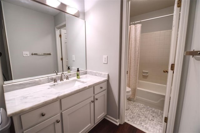 full bathroom featuring vanity, toilet, and shower / bath combo with shower curtain