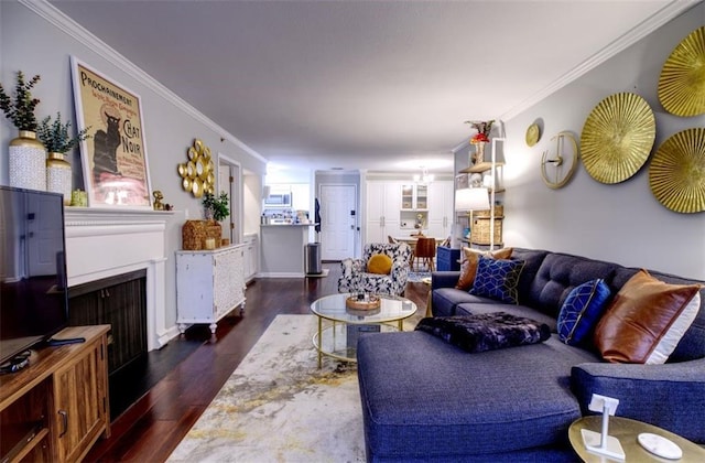 living room featuring dark hardwood / wood-style flooring and crown molding