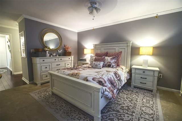 bedroom featuring crown molding, ceiling fan, and dark colored carpet