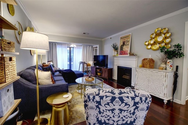 living room featuring dark hardwood / wood-style flooring and ornamental molding