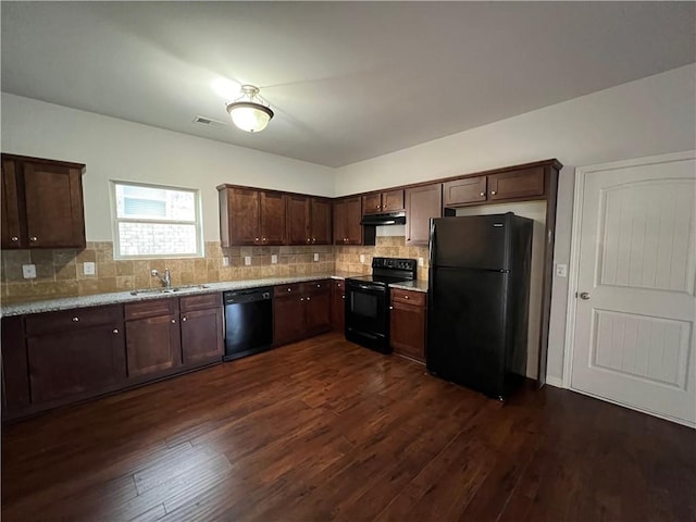 kitchen featuring tasteful backsplash, sink, black appliances, and dark hardwood / wood-style flooring