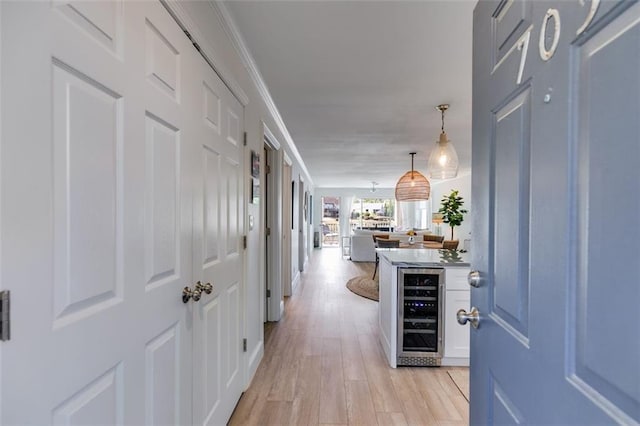 705 Berry Ct, Villa Rica, GA 30180 - hallway with beverage cooler and light wood-type flooring