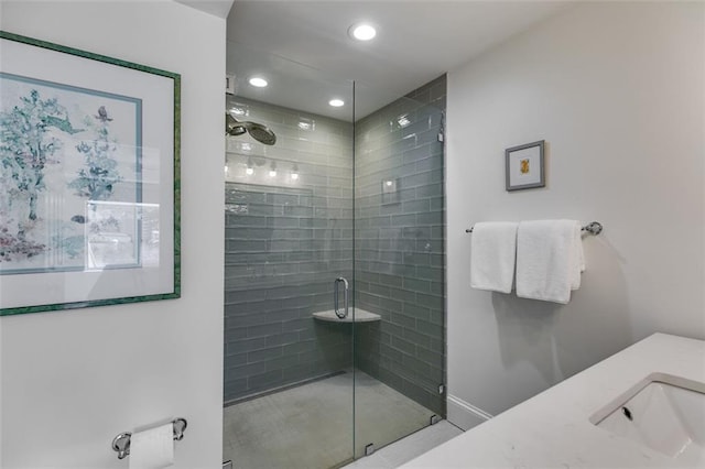 705 Berry Ct, Villa Rica, GA 30180 - bathroom with a stall shower, vanity, recessed lighting, and baseboards