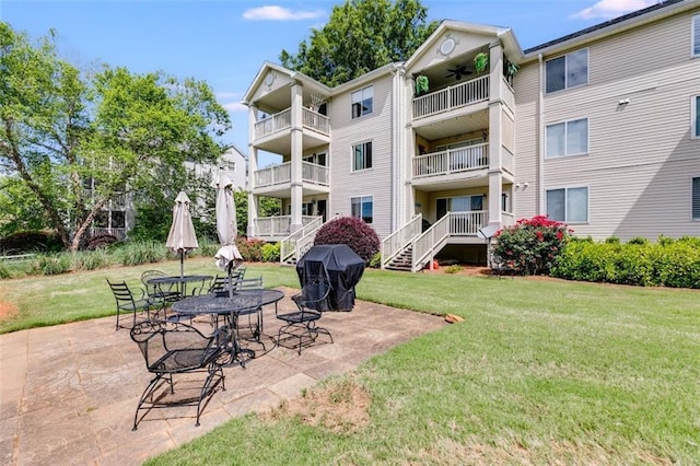 705 Berry Ct, Villa Rica, GA 30180 - view of grassy yard featuring a ceiling fan and a patio