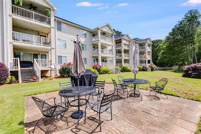 705 Berry Ct, Villa Rica, GA 30180 - view of patio / terrace featuring a ceiling fan and stairway